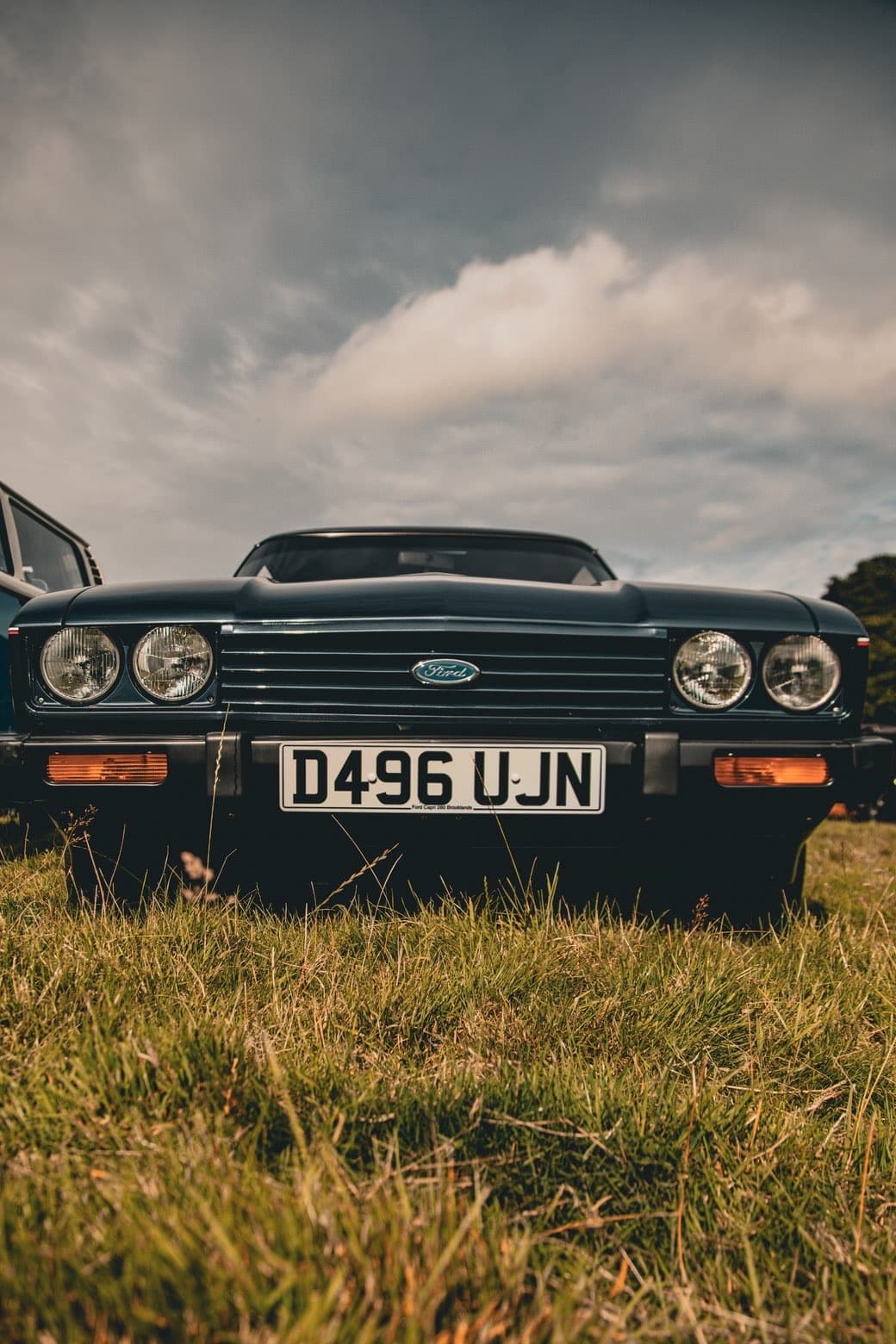 Front detail of a classic car in moody outdoor light