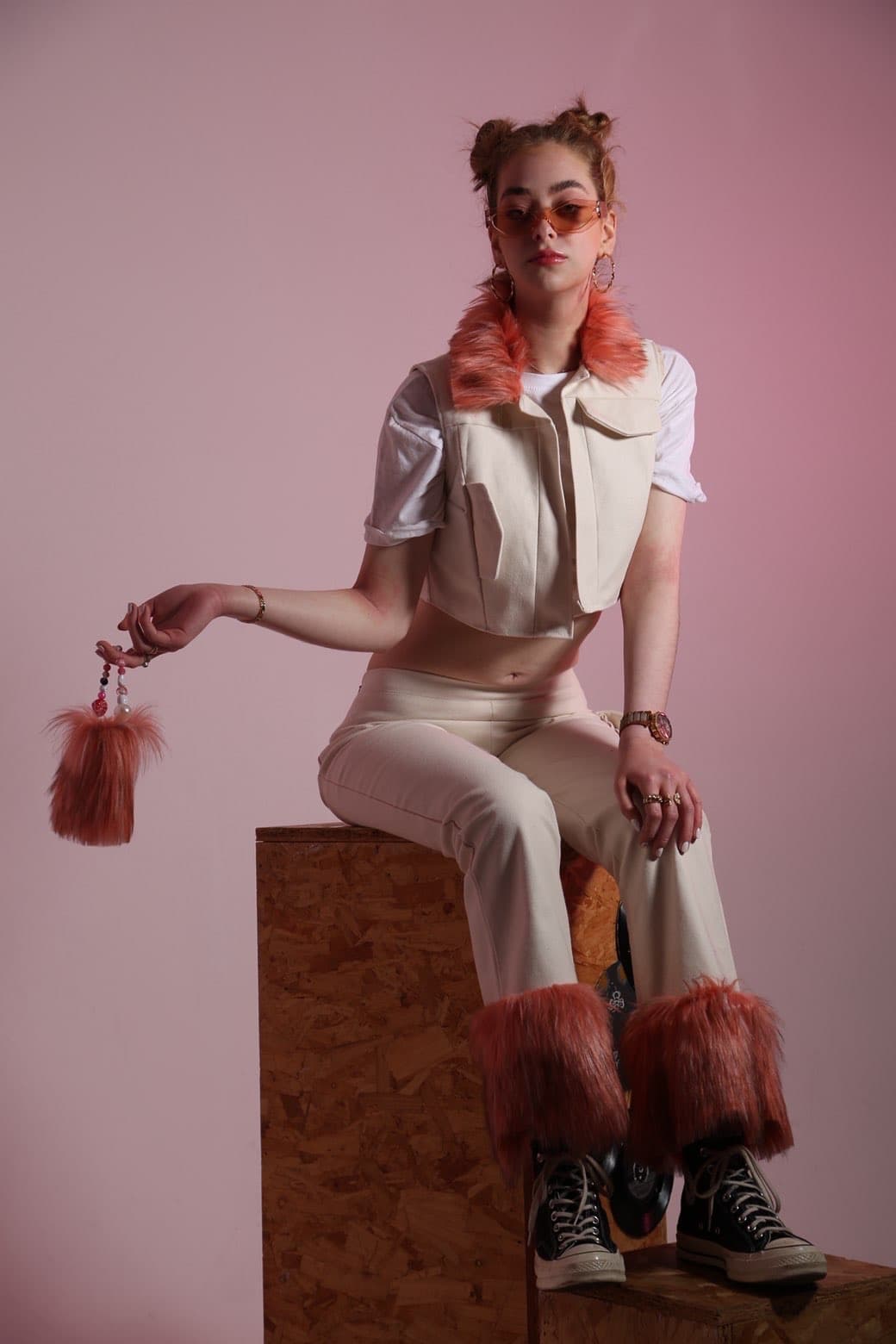 Seated studio fashion portrait with white styling