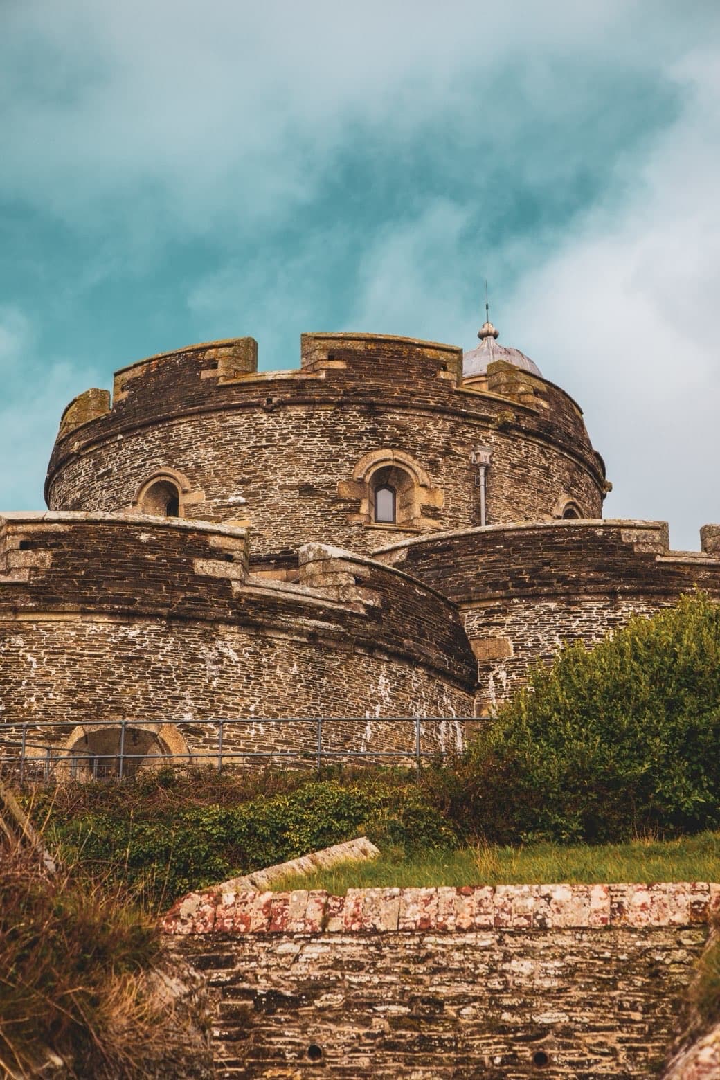 Stone tower photographed against a textured sky